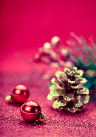 Christmas holiday concept. Red Christmas balls with star and Christmas branch tree on red background. Bokeh. Retro.の写真素材