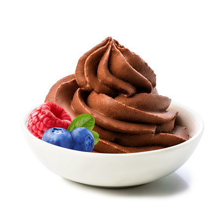 Bowl of chocolate yogurt or whipped cream with berries - raspberry, blueberry isolated on white background by clipping path. Macro.の写真素材