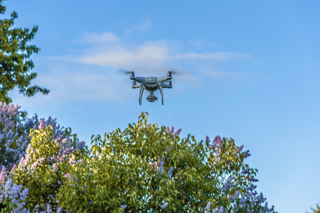 Drone quad copter with digital camera on the sky.の写真素材