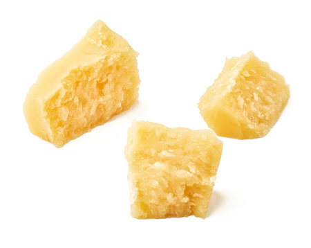 Pieces of Parmesan cheese on white background. Top view.の写真素材