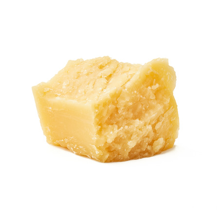 Piece of Parmesan cheese on white backgroundの写真素材