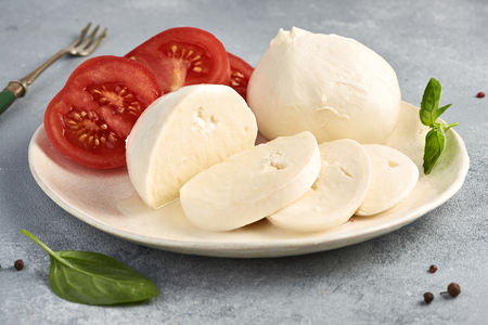 Mozzarella Buffalo with basil leaves and tomatoes.の写真素材