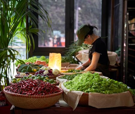 MOSCOW, RUSSIA - JUNE 12, 2018. Danilovsky Market. Vietnam woman cooking. Vietnamese street food....