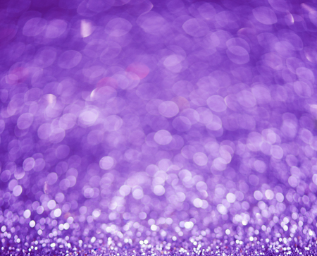 Lilac or violet bokeh background of glitter lightsの写真素材