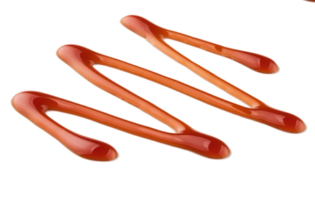 Sweet caramel sauce isolated on white background, top view.の写真素材