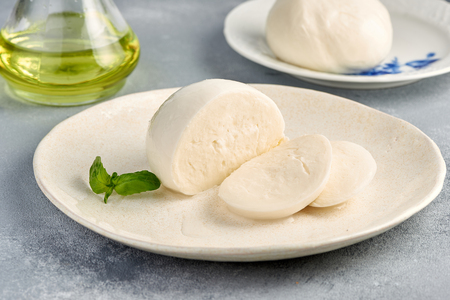 Sliced Mozzarella Buffalo with basil leavesの写真素材