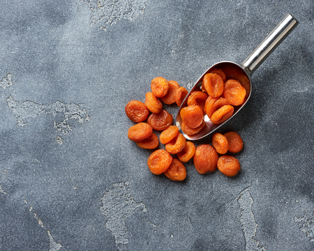 Dried apricots on gray background. witn copy space. Top view.の写真素材