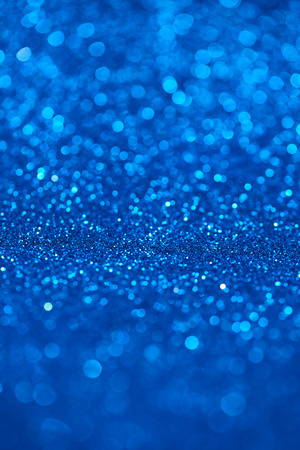 Blue bokeh background of glitter lightsの写真素材