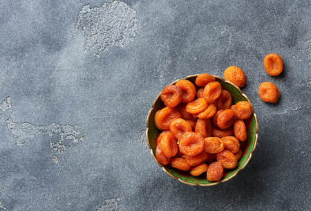 Dried apricots on gray background. with copy space. Top view.の写真素材