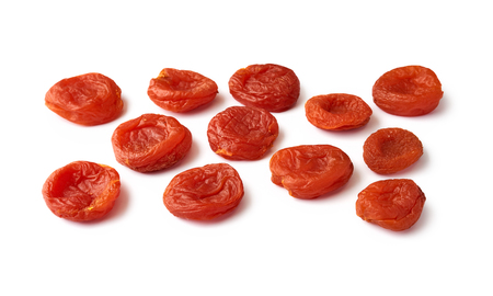 Heap of dried apricots isolated on white background. Fruit dried in the sun.の写真素材