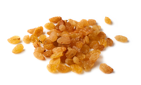 Heap of yellow raisins isolated on white backgroundの写真素材