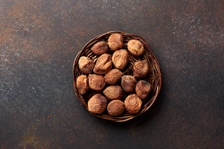 Sun dried apricots on brown background. Top view.の写真素材
