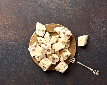 Eastern delicacy. Halva, sweetness, dessert on brown background.の写真素材
