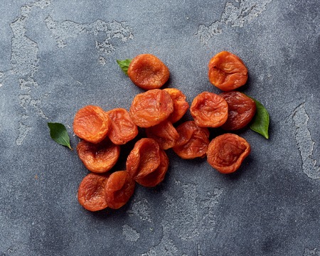 Dried apricots on gray background with copy space. Top view.の写真素材