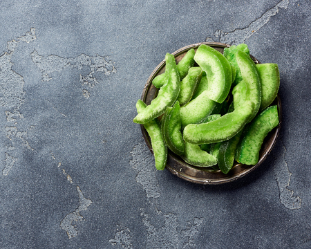 Dried pomelo slices on gray concrete background. Top view of candied fruitsの写真素材