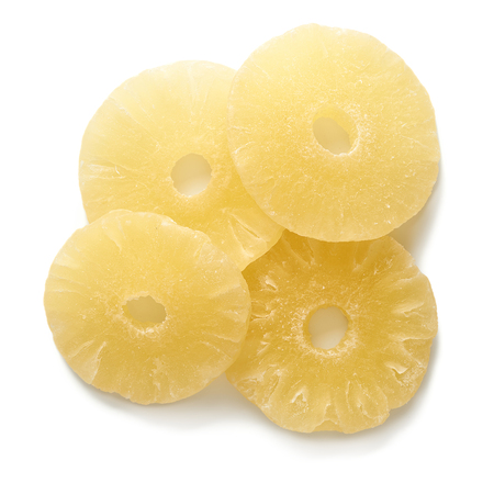 Sweet dried pineapple rings isolated on white background. Top view of candied sliced fruits.の写真素材