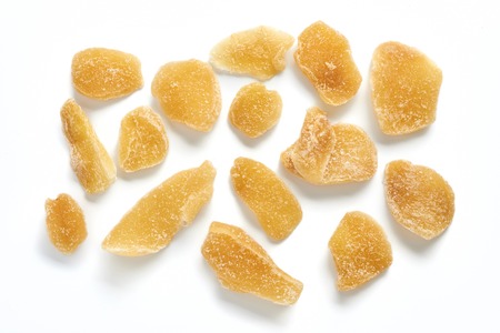 Dried sweet ginger with sugar isolated on a white background. Top view.の写真素材