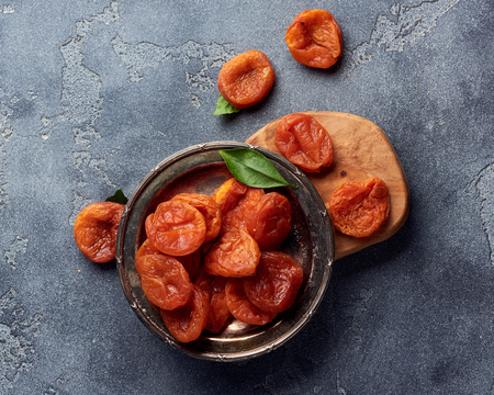 Dried apricots on gray background with copy space. Top view.の写真素材