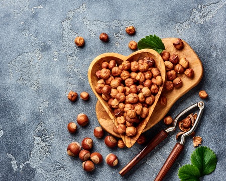 Hazelnuts with nutcracker on gray background. Top view of nuts.の写真素材