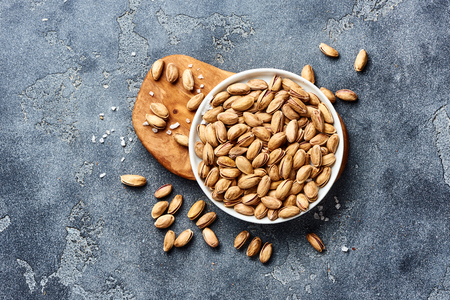 Salted Pistachios nuts with copy space. Top view of snacks.の写真素材