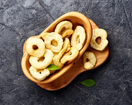 Dried apple rings on gray background. Top view.の写真素材