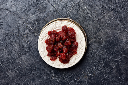 Dried sweet strawberry on a black background. Top view of a candied berries.の写真素材
