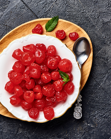 Candied dried cherry on plate. Top view of berries.の写真素材