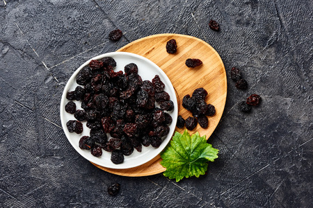 Dried cherry on plate. Top view of berries.の写真素材