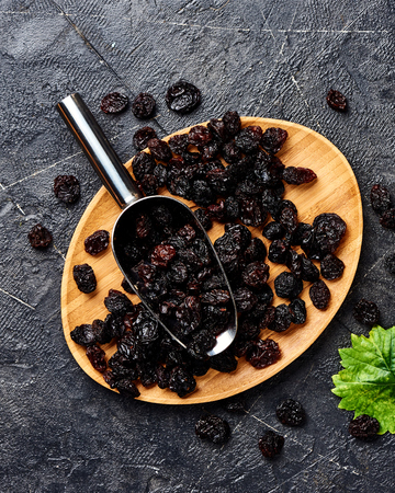 Dried cherry on plate. Top view of berries.の写真素材