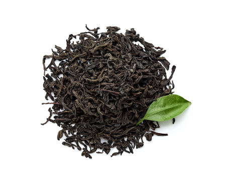 Dried black tea leaves isolated on white background. Top view.の写真素材