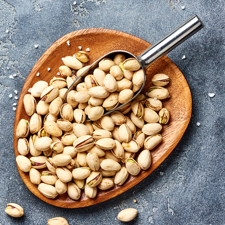 Salted Pistachios nuts. Top view of snacks.の写真素材