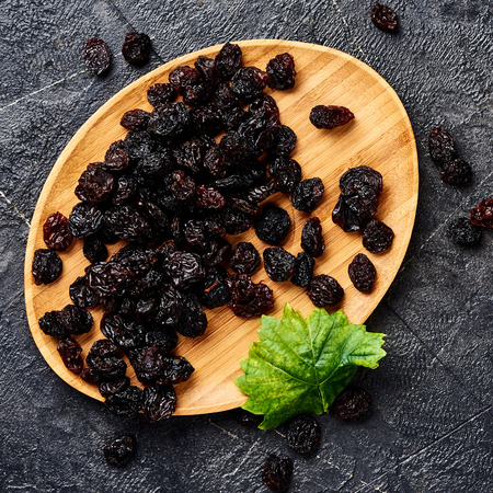 Dried cherry on plate. Top view of berries.の写真素材