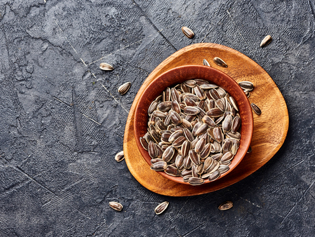 Sunflower seeds on a black background. Top view of snacks.の写真素材