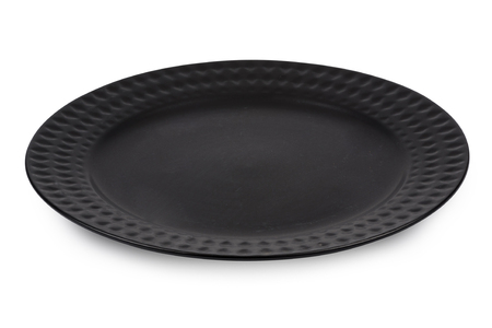 Black dinner plate isolated on white background.の写真素材