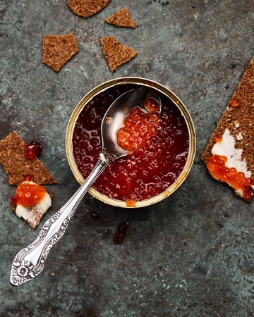 red caviar int tin with crispbreads and butterの写真素材