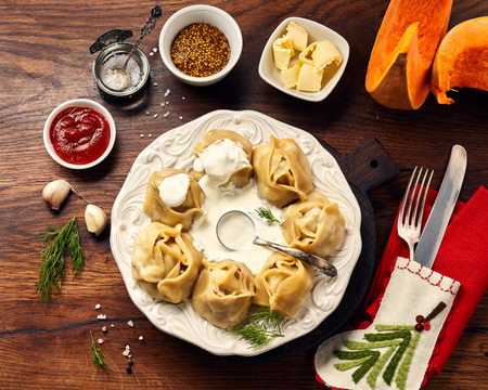Asian steamed homemade dumplings Manti with pumpkin and garlic. Christmas or New Year dish. Top view.の写真素材