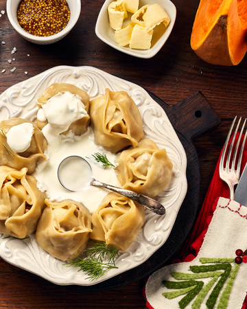 Asian steamed homemade dumplings Manti with pumpkin and garlic. Christmas or New Year dish. Top view.の写真素材