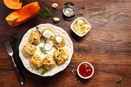 Asian steamed dumplings Manti with pumpkin and garlic.の写真素材