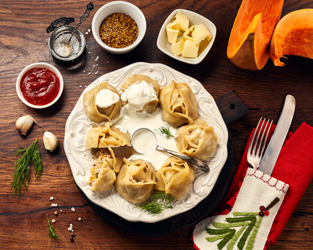 Asian steamed homemade dumplings Manti with pumpkin and garlic. Christmas or New Year dish. Top view.の写真素材