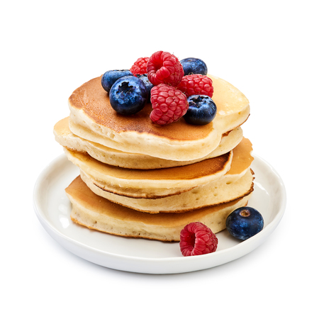Tasty homemade pancakes with berries on white backgroundの写真素材