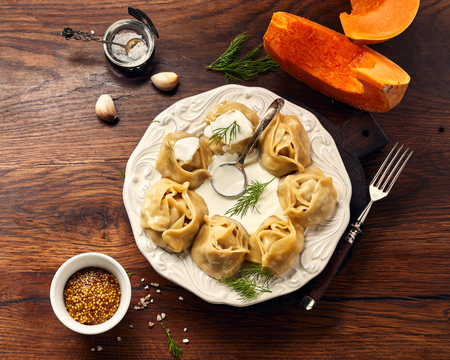 Asian steamed dumplings Manti with pumpkin and garlic.の写真素材