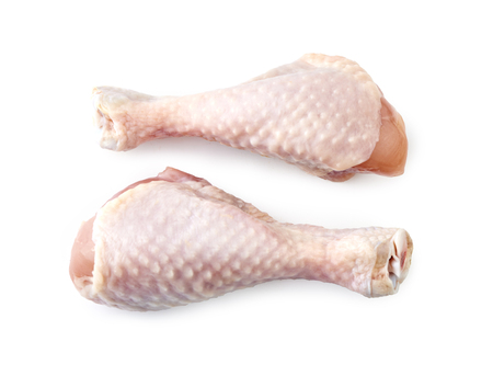 Two raw chicken legs isolated on white background. Top view.の写真素材