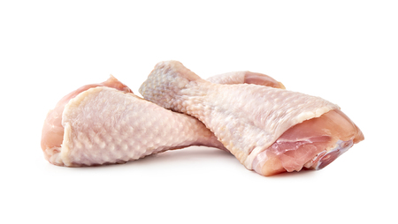 Raw chicken legs isolated on white backgroundの写真素材
