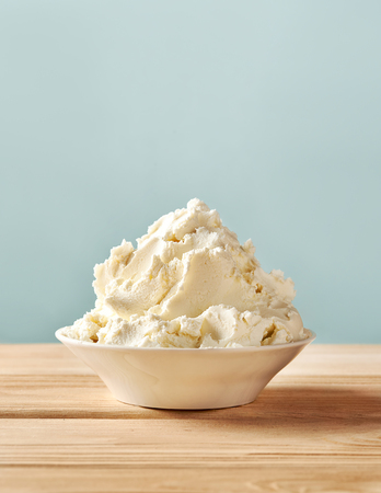 Mascarpone cheese on wooden table. Homemade soft cream cheese.の写真素材
