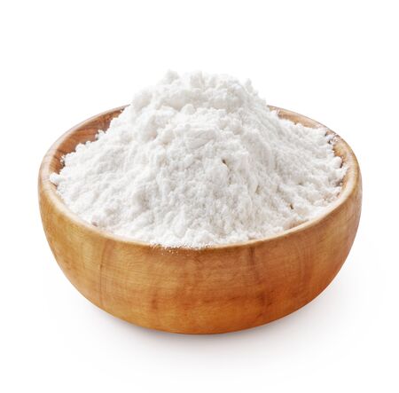 Gluten free flour. Wooden bowl of rice or wheat flour isolated on white background.の写真素材