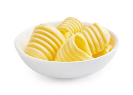 Butter curls or butter rolls in white bowl isolated on white background.の写真素材
