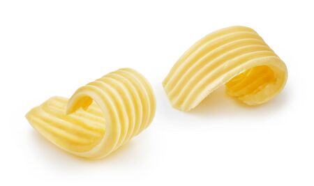Butter curls or butter rolls isolated on white backgroundの写真素材