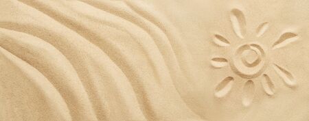 Tropical sand background with sand waves and sun. Sandy beach texture with copy space. Top viewの写真素材