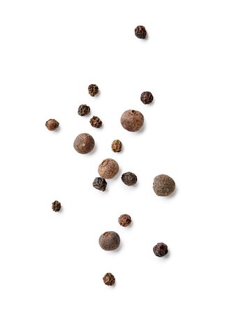 Mix of black pepper and pimento isolated on white background. Top view of allspices and spices.の写真素材