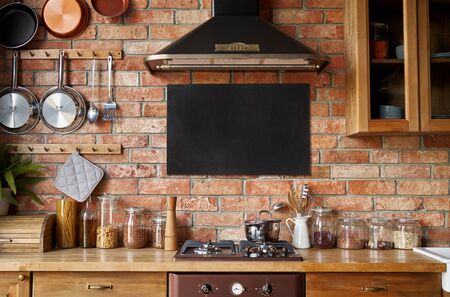 Mock up of chalkboard in kitchen interior. Panoramic background with kitchen utensils.の写真素材